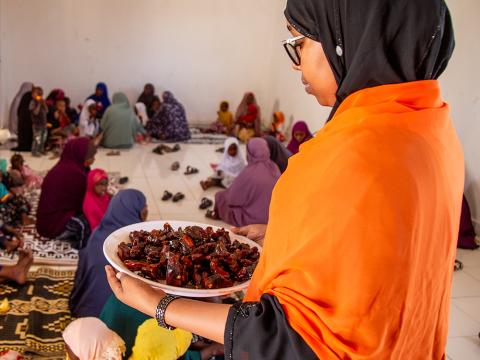 World Vision staff with food